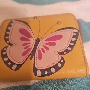 Really?Cute mustard color wallet  wirh stitched in butterfly.